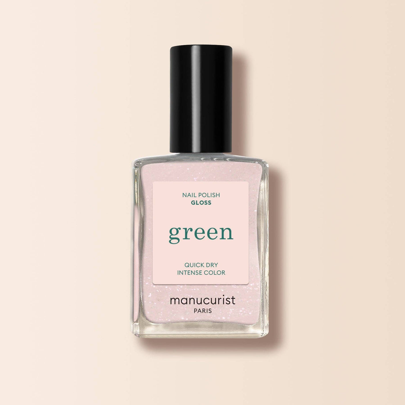 Frasco de esmalte de uñas Manucurist Green color Bliss, un rosa suave con destellos para un acabado brillante.