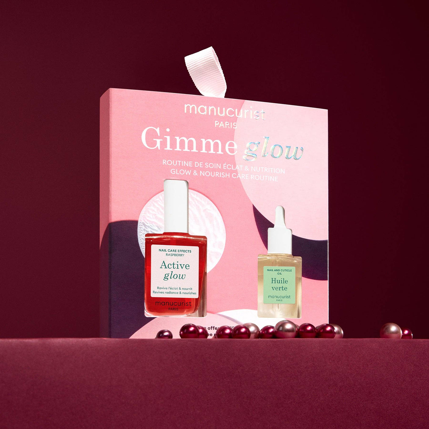 Envase de regalo rosado del kit Gimme Glow, ideal para cosmética ética y sostenible.
