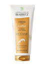 Tubo blanco y dorado de crema corporal iluminadora Biarritz Océane de 200 ml