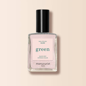 Frasco de esmalte de uñas Manucurist Green color Bliss, un rosa suave con destellos para un acabado brillante.