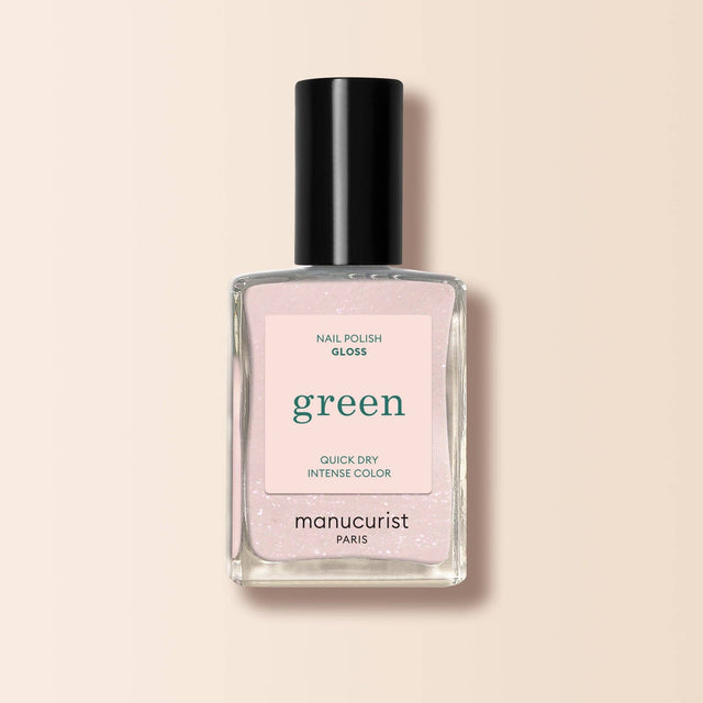 Frasco de esmalte de uñas Manucurist Green color Bliss, un rosa suave con destellos para un acabado brillante.