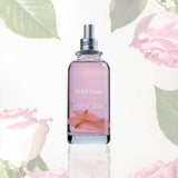 Frasco de Jimmy Boyd Wild Roses de 200 ml con pétalos de rosa y fondo floral